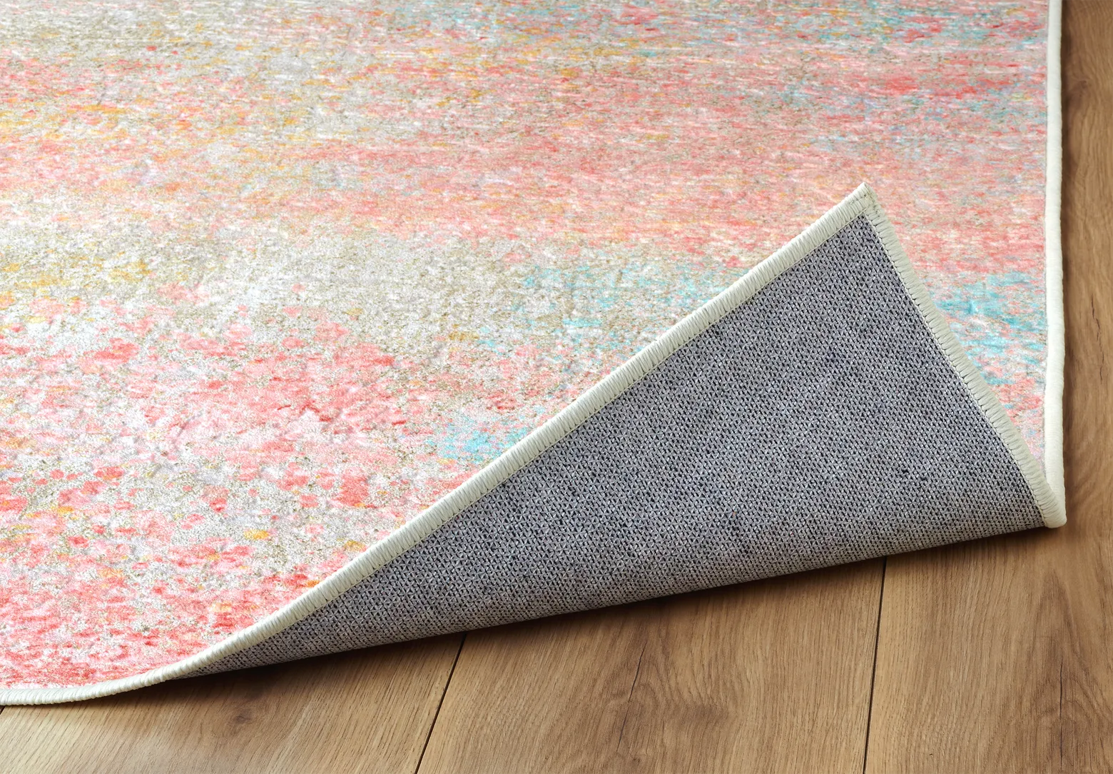 Angolo del tappeto Fiorith bouclé 3D con bordo rifinito e retro antiscivolo.