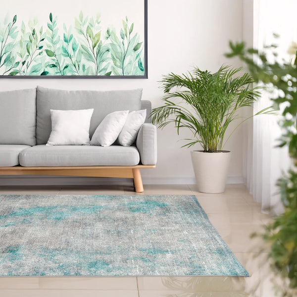 Tappeto Onis Turch bouclé 3D 130×190 cm ambientato in salotto moderno, palette morbida sabbia e azzurro.