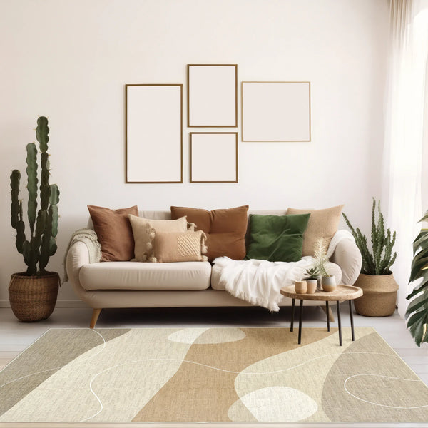 Tappeto Dunis 200x290 cm ambientato in open space moderno, con pattern naturale a onde nei toni sabbia e panna