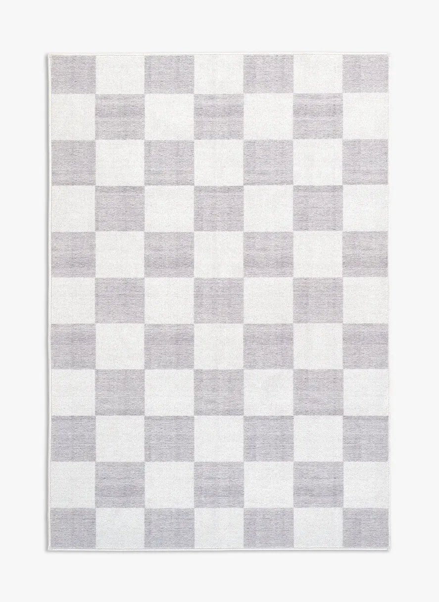 Tappeto Jack LtGrey 130×190 cm in pelo taftato, motivo a quadri regolari grigio chiaro e panna visto dall’alto.