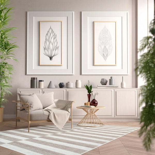 Tappeto Strider Grey 130×190 cm in angolo lettura con poltrona chiara, piccolo tavolino e piante.