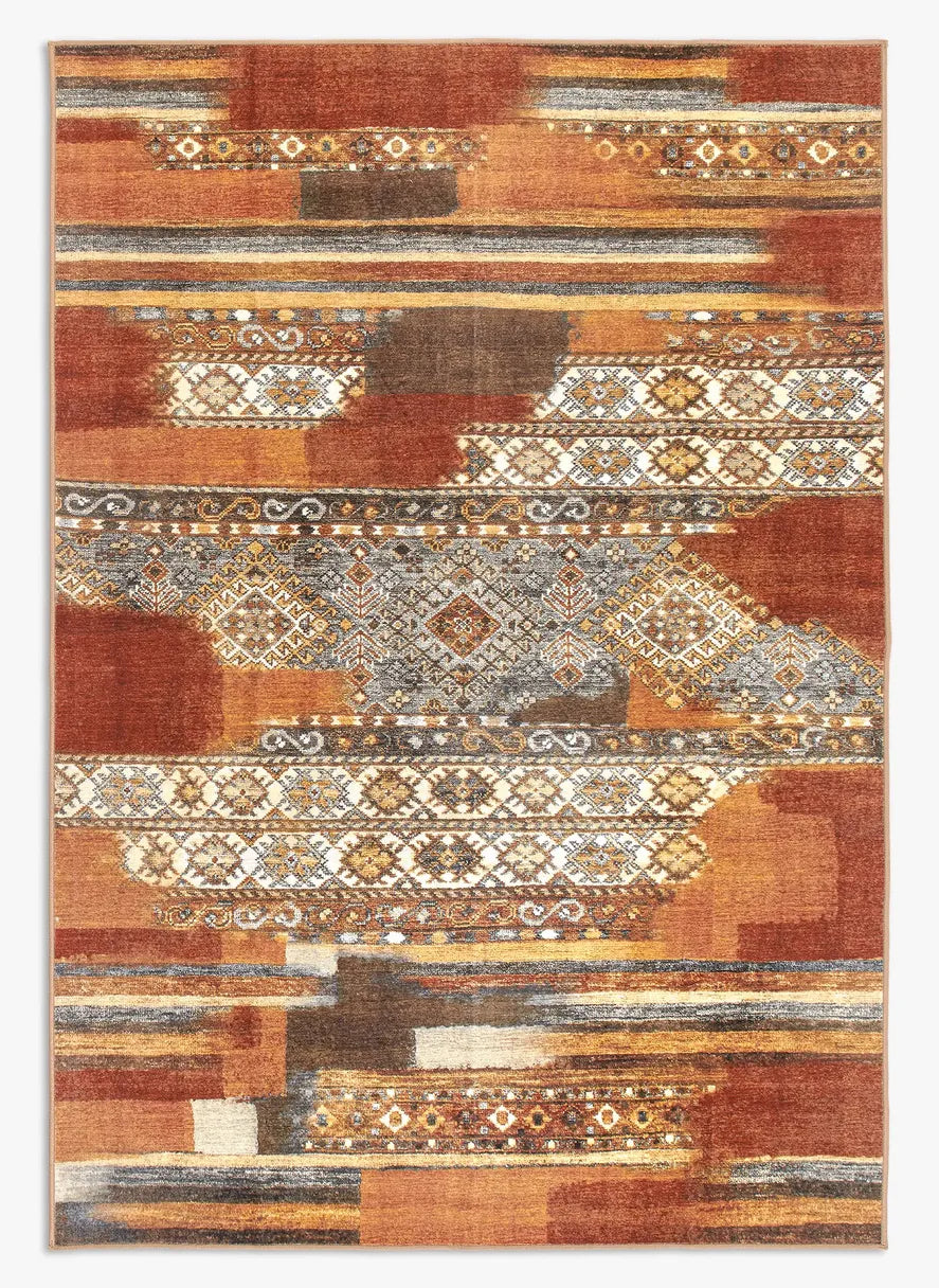 Tappeto Myfar 160x230 cm visto dall’alto, con blocchi irregolari nei toni terracotta, senape e crema.