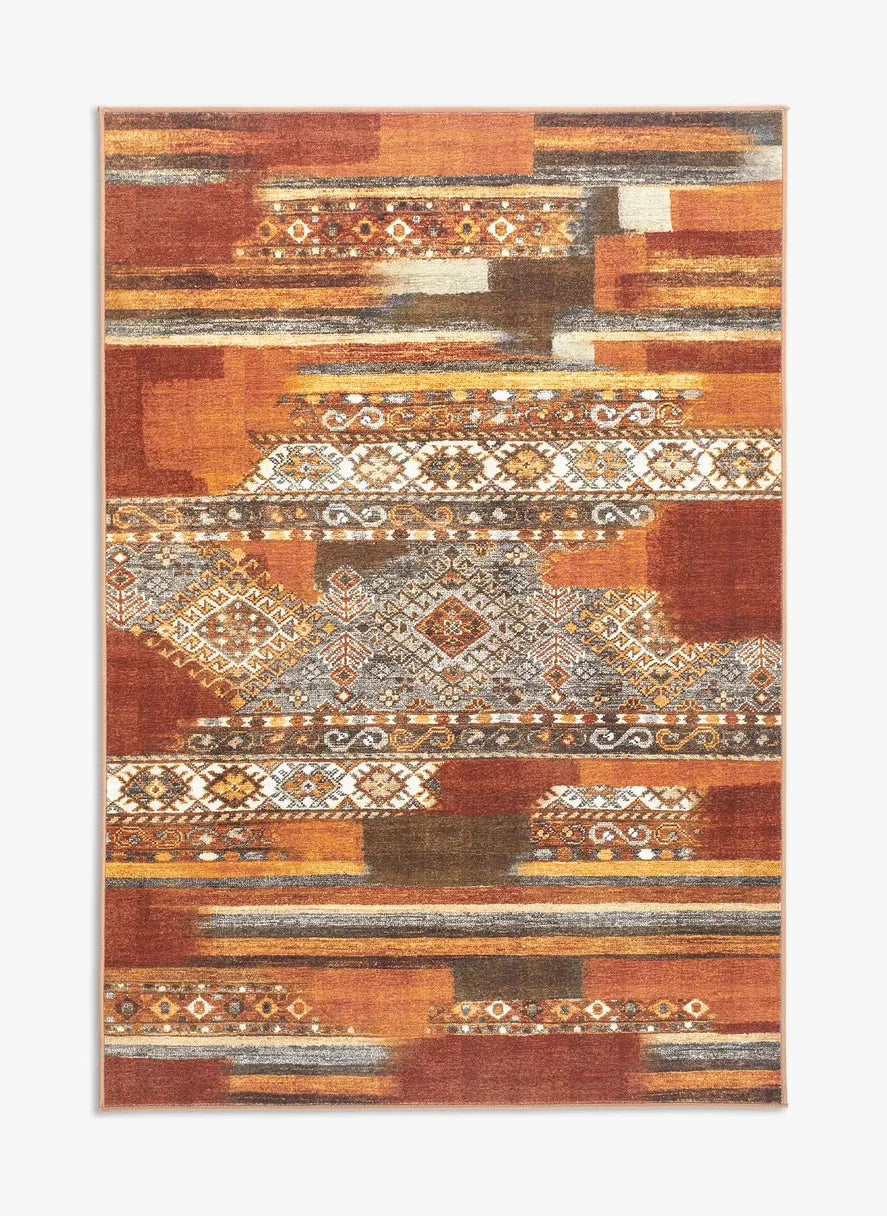 Tappeto Myfar 130x190 cm visto dall’alto, con pattern etnico e sfumature calde terracotta, crema e ruggine.