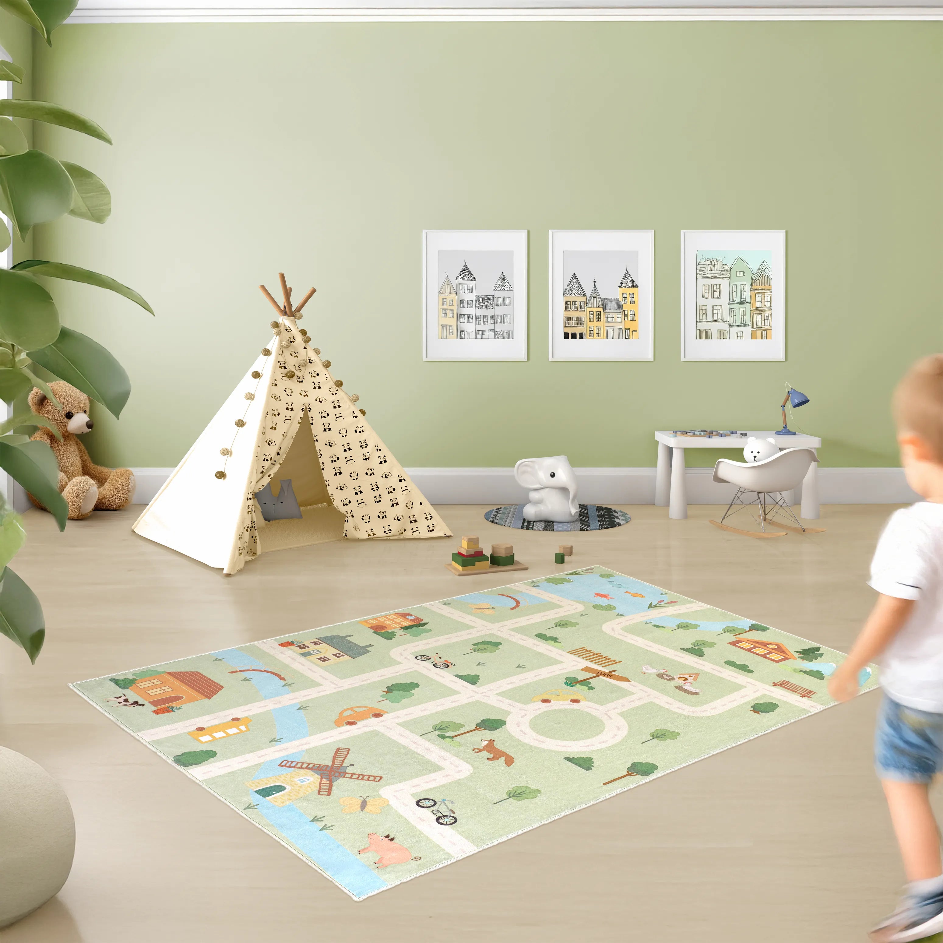 Tappeto Ecovia 120×180 cm usato come tappeto gioco per bambini, illustrazione di strade, casette e natura ben visibile a pavimento.