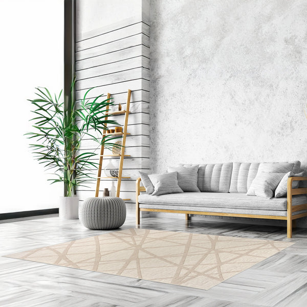 Tappeto Dome 160×230 cm in salotto nordico con divano in legno e cuscini grigi, parete a doghe bianche, scala portaoggetti e pouf lavorato; lavabile a 40° in lavatrice e asciugabile in asciugatrice, antiscivolo e impermeabile.