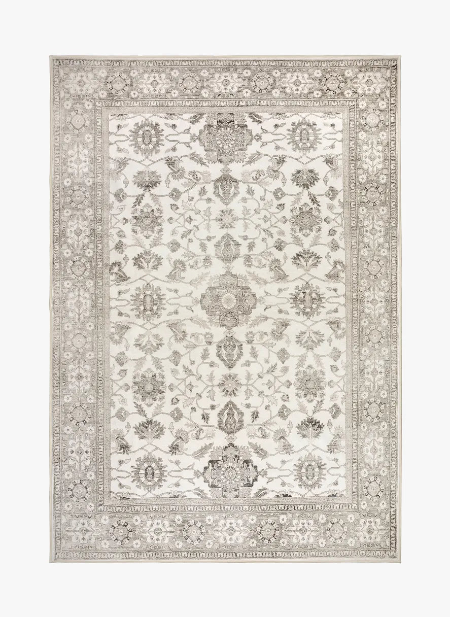 Tappeto Farah 130×190 cm con motivo floreale raffinato su base avorio e beige; lavabile a 40° in lavatrice e asciugabile in asciugatrice, antimacchia, antiscivolo e impermeabile.