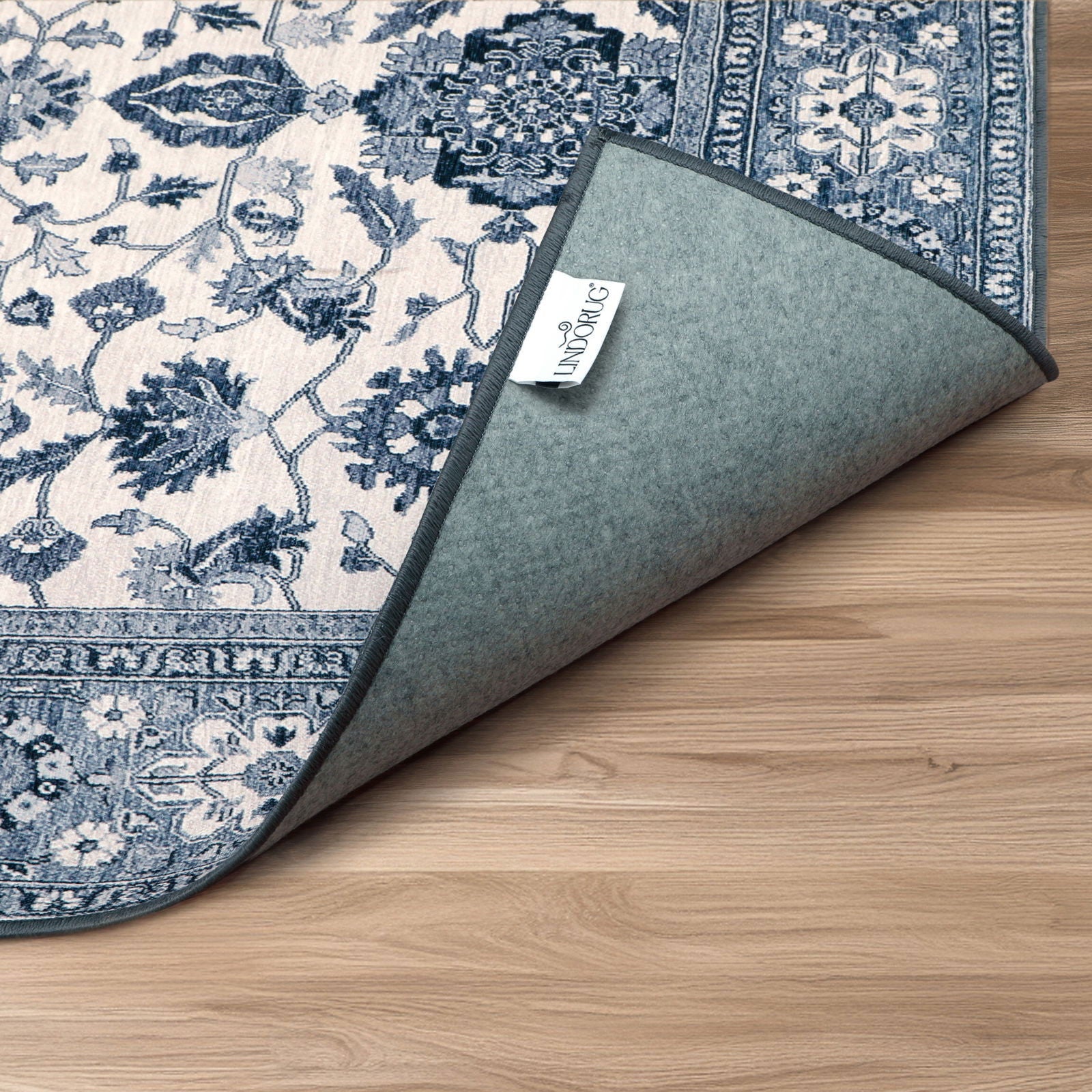 Angolo piegato tappeto Farahan collezione Chenny mostra retro antiscivolo e logo Lindorug