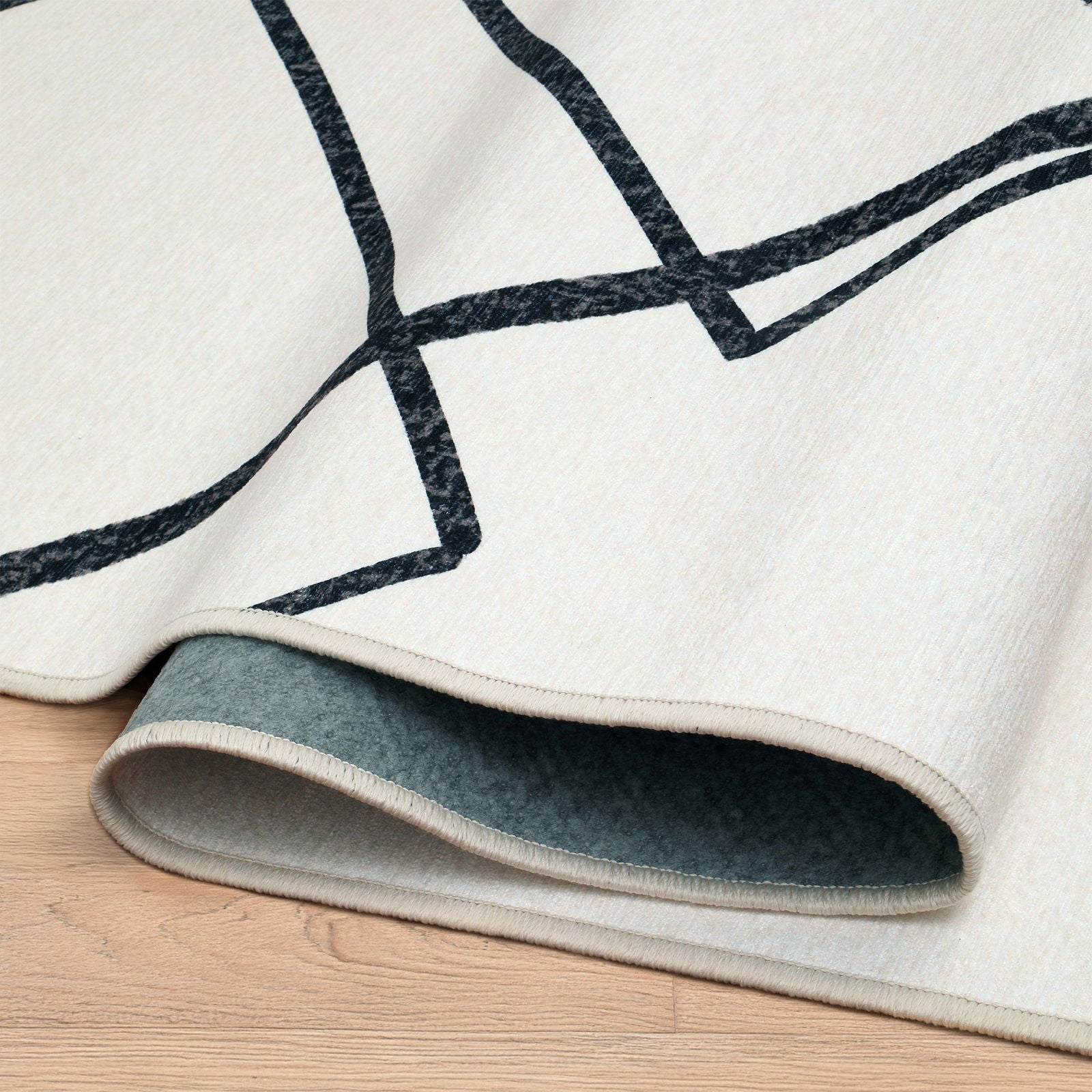 Angolo piegato tappeto Malik collezione Chenny mostra retro antiscivolo e orlo