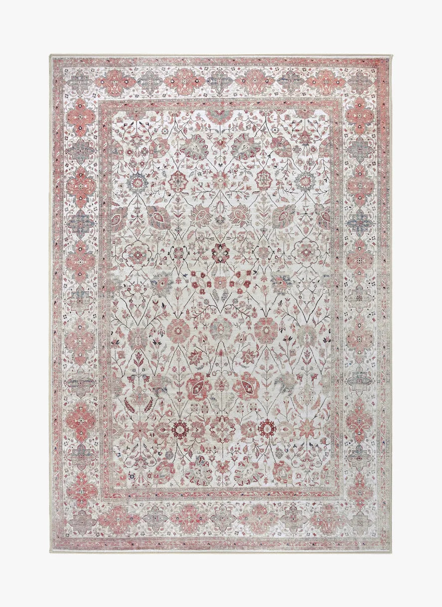 Tappeto Sindhi 130 × 190 cm in ecru e corallo con motivo floreale orientale, lavabile a 40°, antimacchia e antiscivolo.
